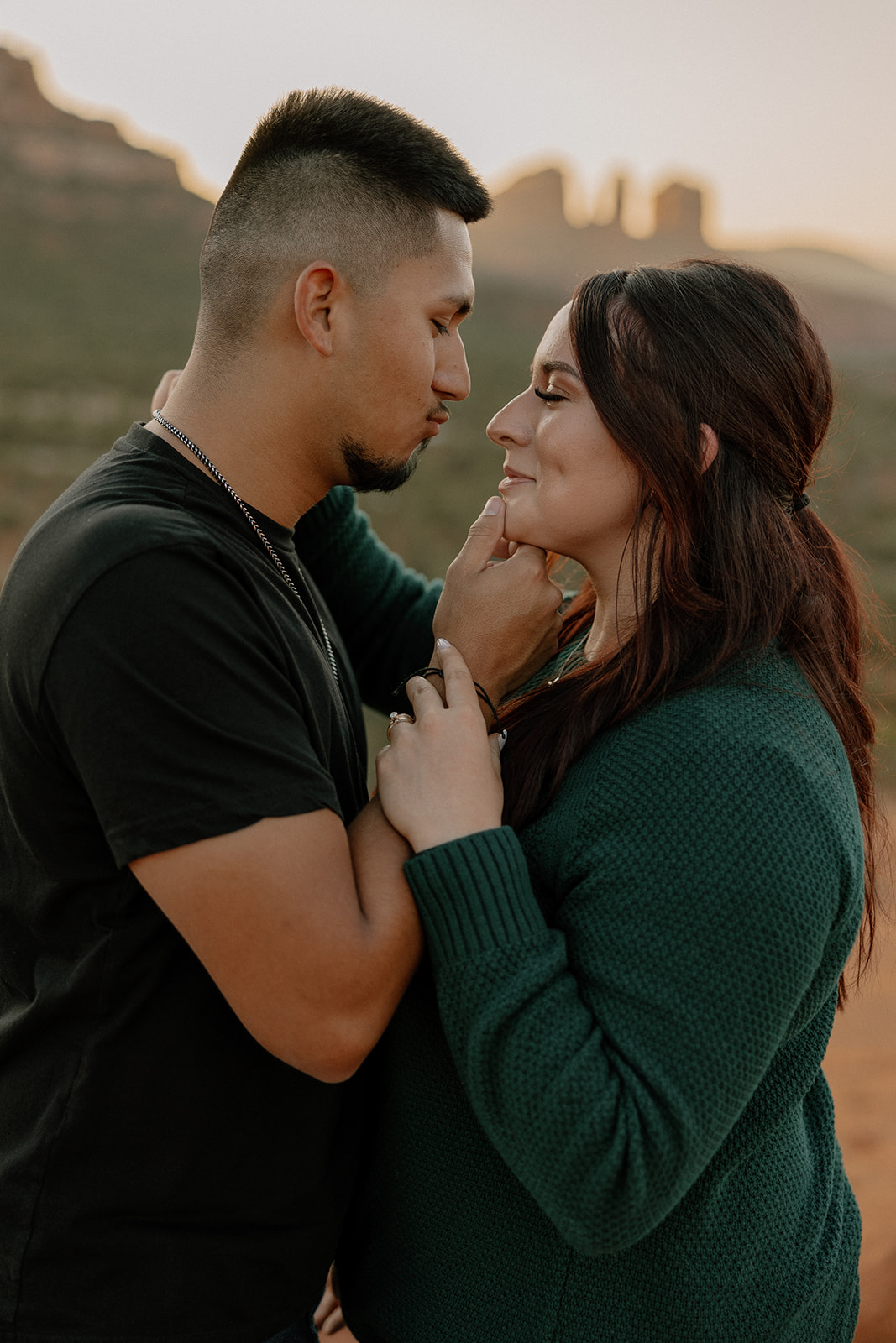 Beautiful couple shares a romantic moment during their dreamy west fork trail in Sedona Arizona engagement photoshoot 