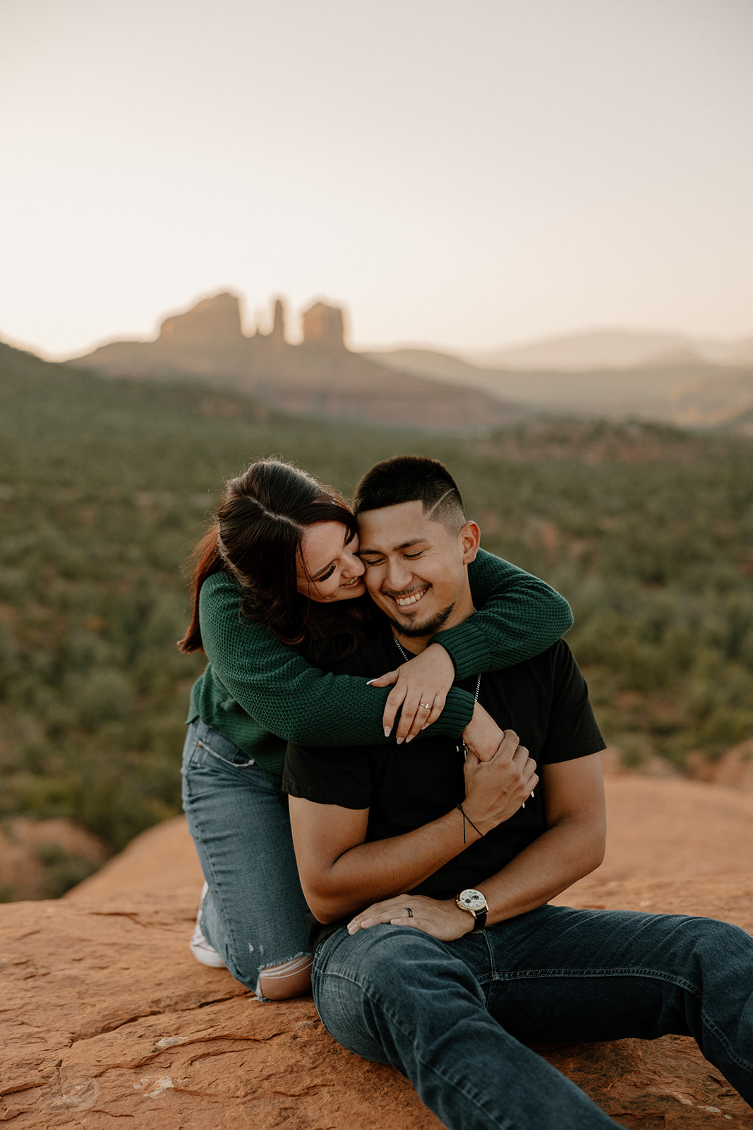 Beautiful couple embrace each other during their dreamy west fork trail in Sedona Arizona engagement photoshoot 