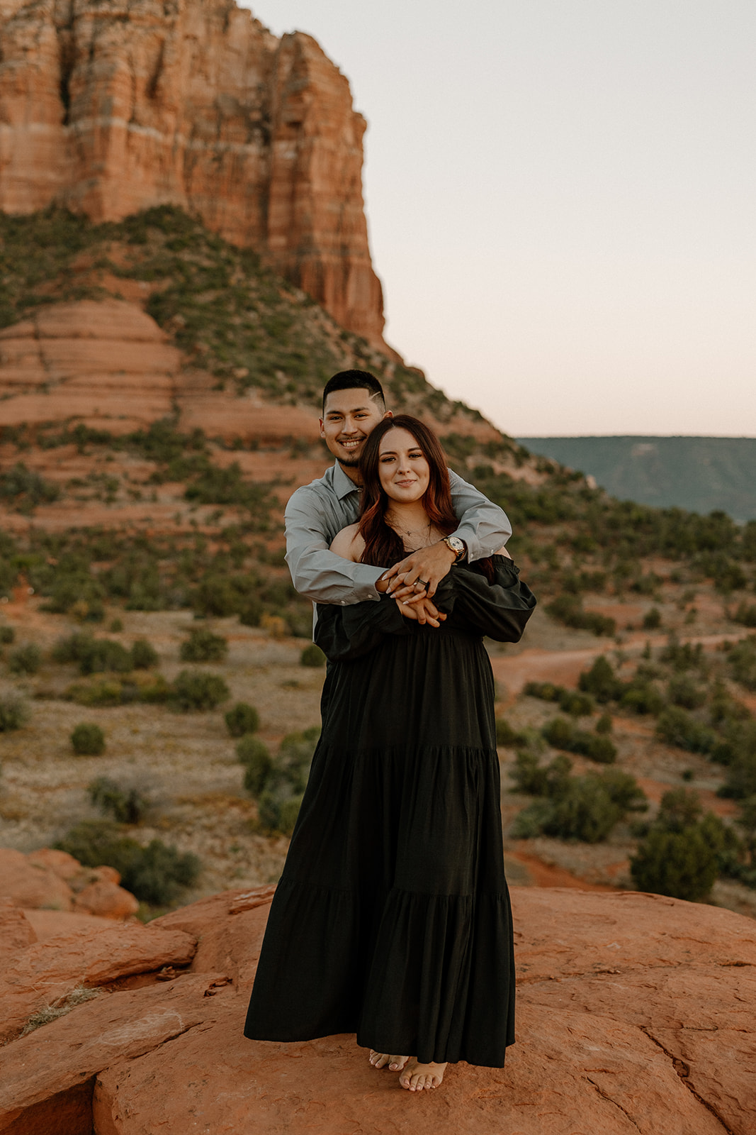 Stunning couple share a hug with the beautiful Arizona nature in the backdrop