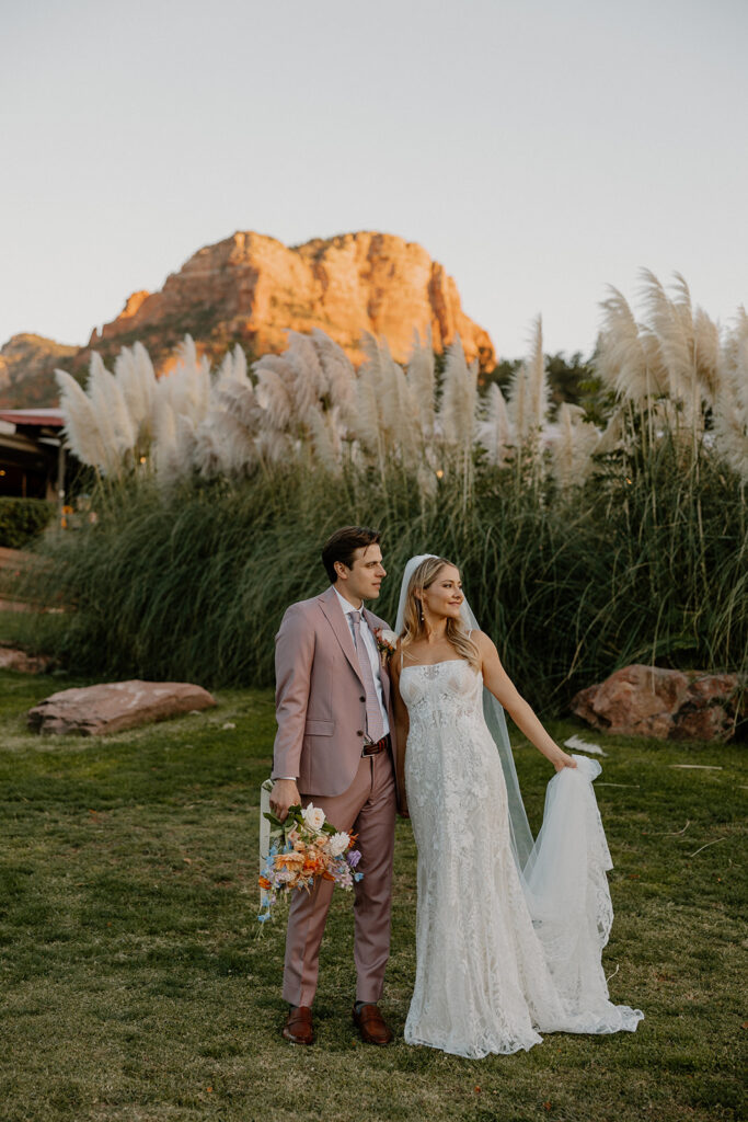 Bride and groom pose in front of the stunning Arizona nature