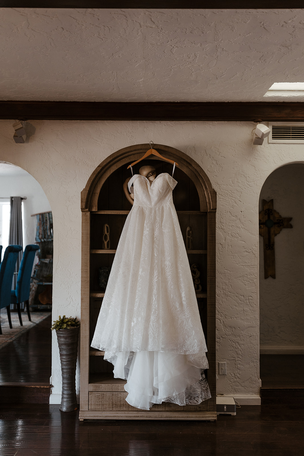 Wedding dress hangs up ready before the stunning Arizona wedding day