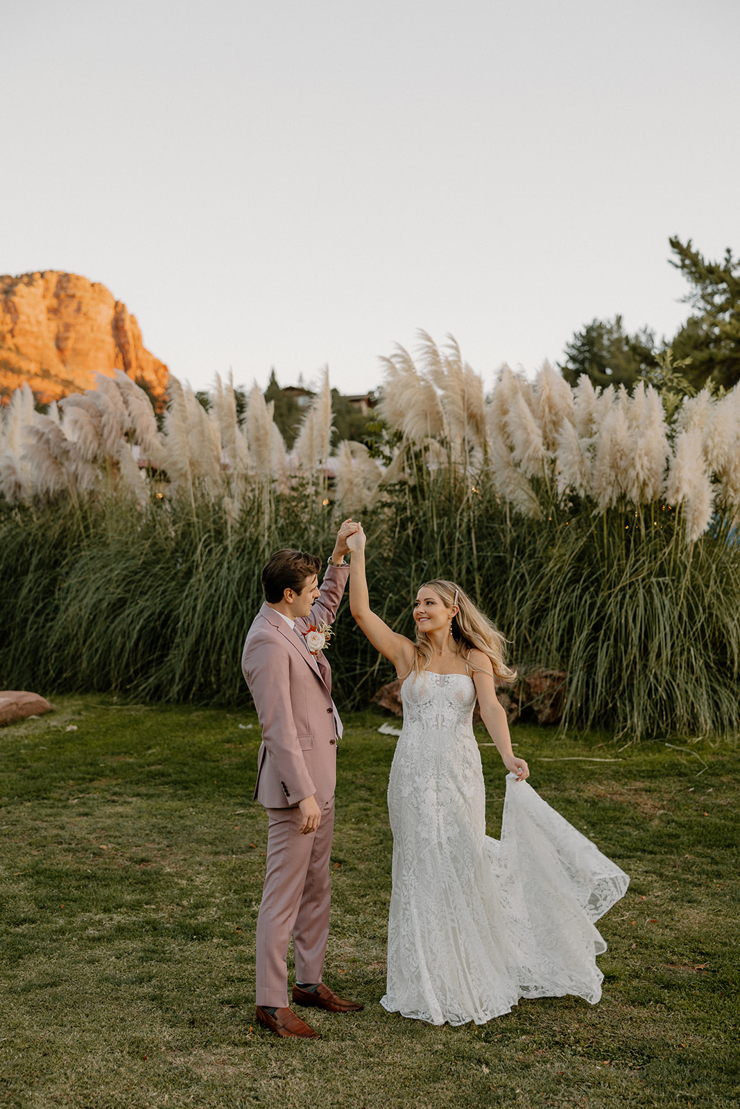 Bride and groom pose together after their dreamy fairy garden Arizona wedding