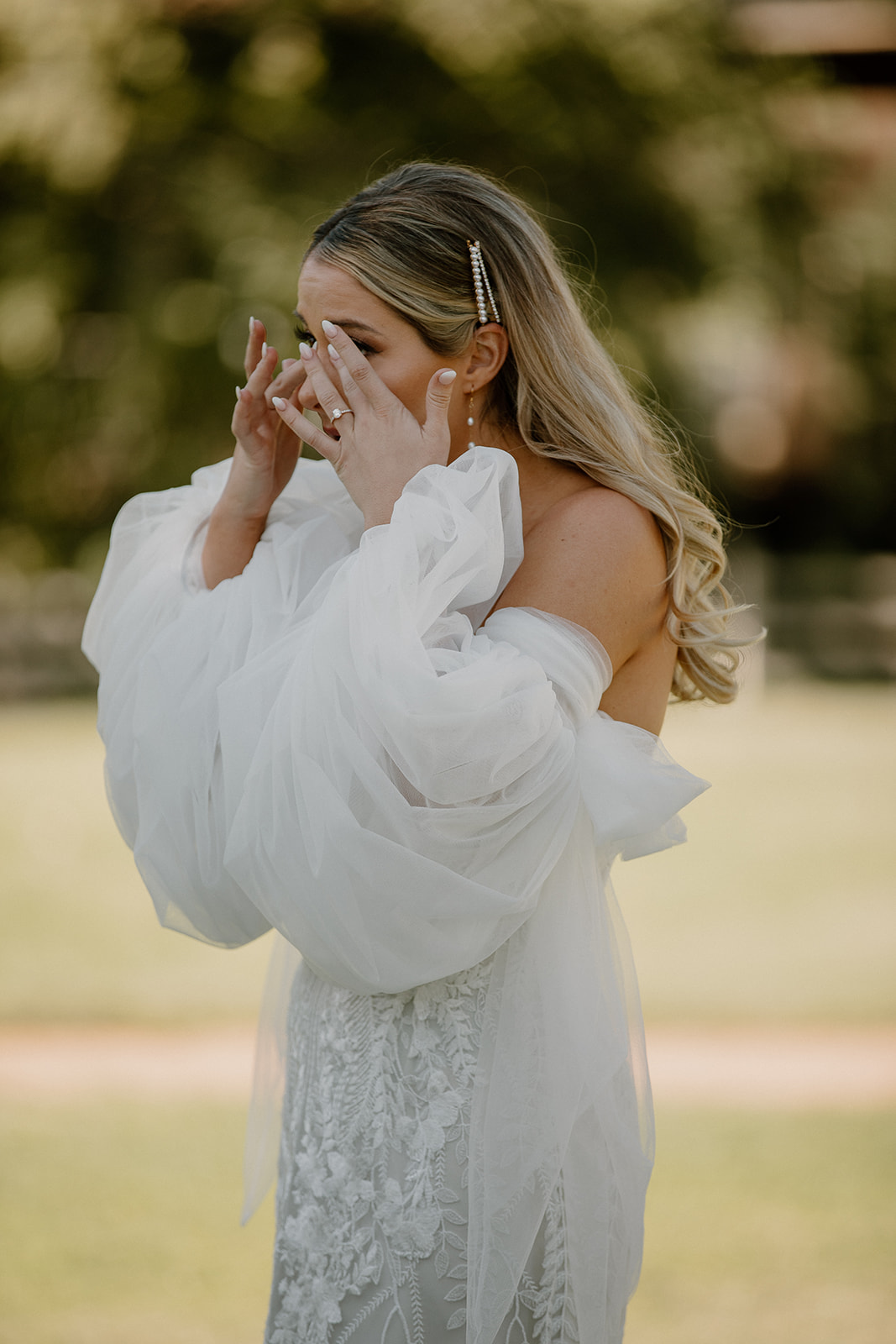 bride wipes away tears during her dreamy Arizona wedding day