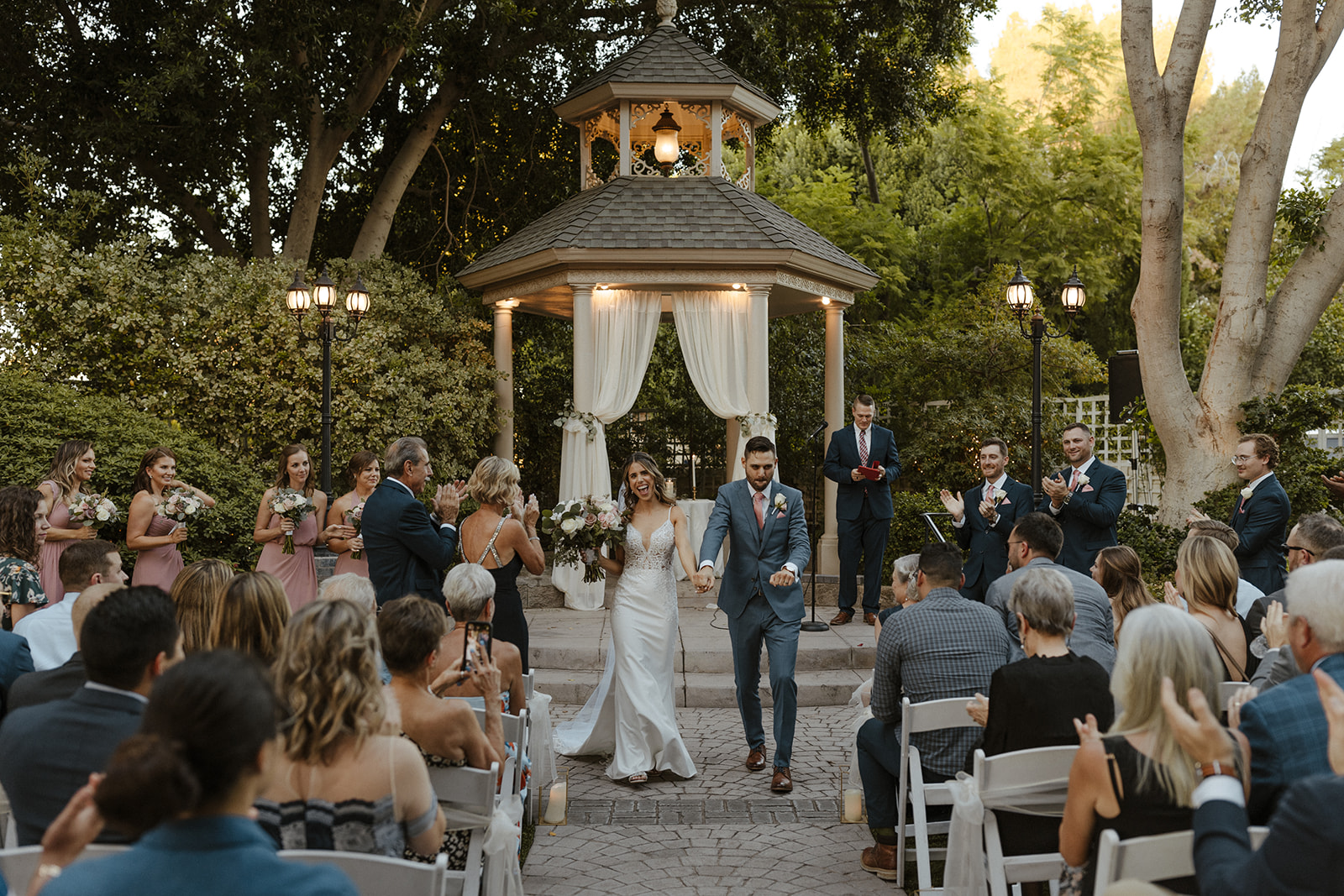 Stunning bride and groom exit their dreamy The Wright House Garden Reception Center wedding!