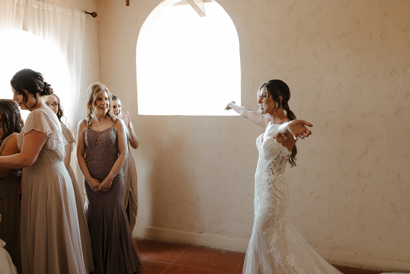 Stunning bride greets her bridesmaids at one of Arizonas top 10 wedding venues!