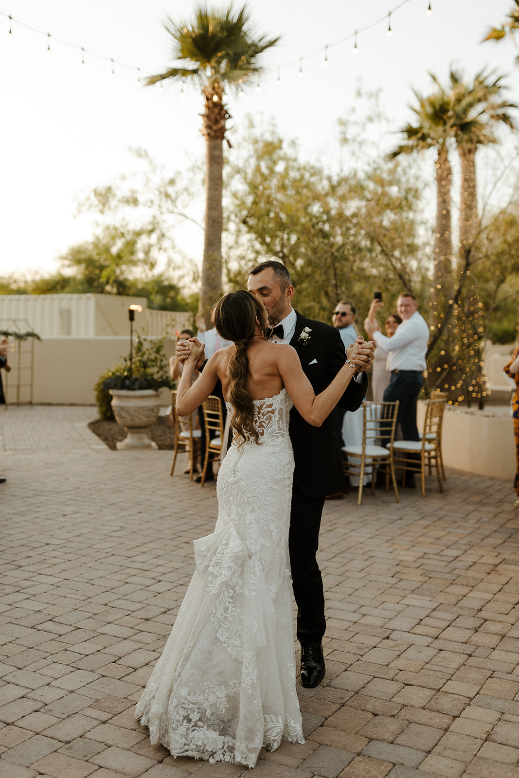 Bride and groom dance together during their Arizona wedding at The Secret Garden Event Center