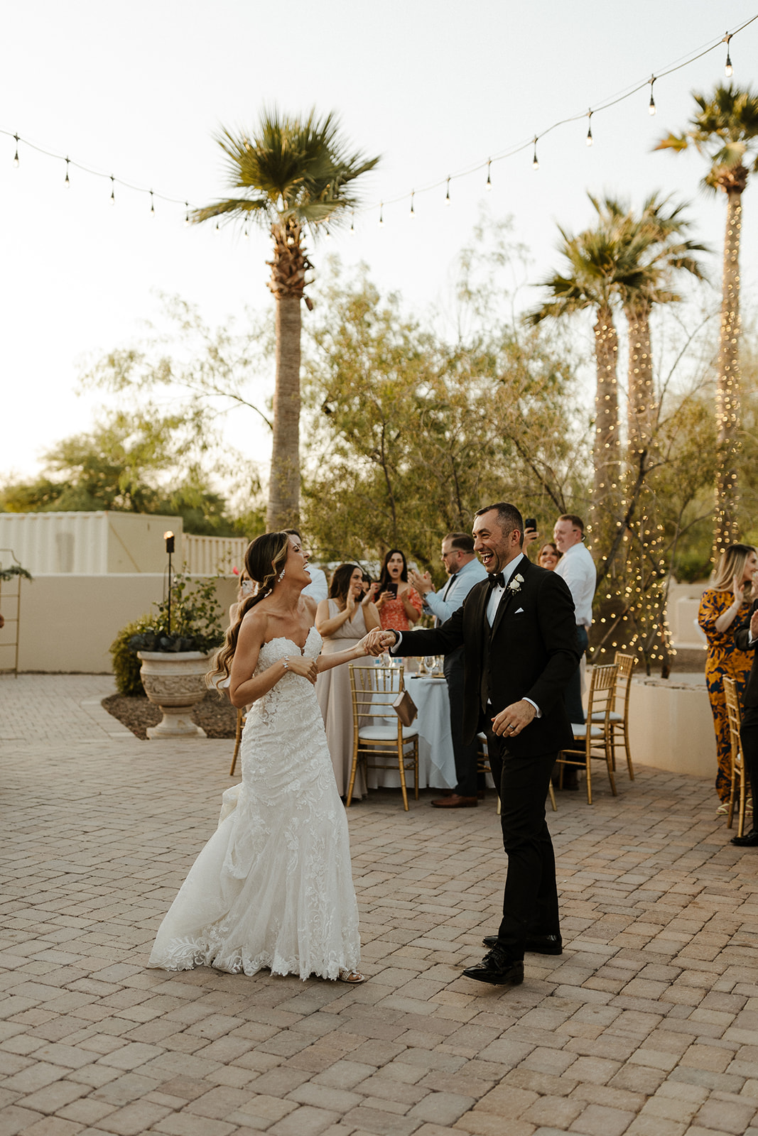 Bride and groom dance together during their Arizona wedding at The Secret Garden Event Center