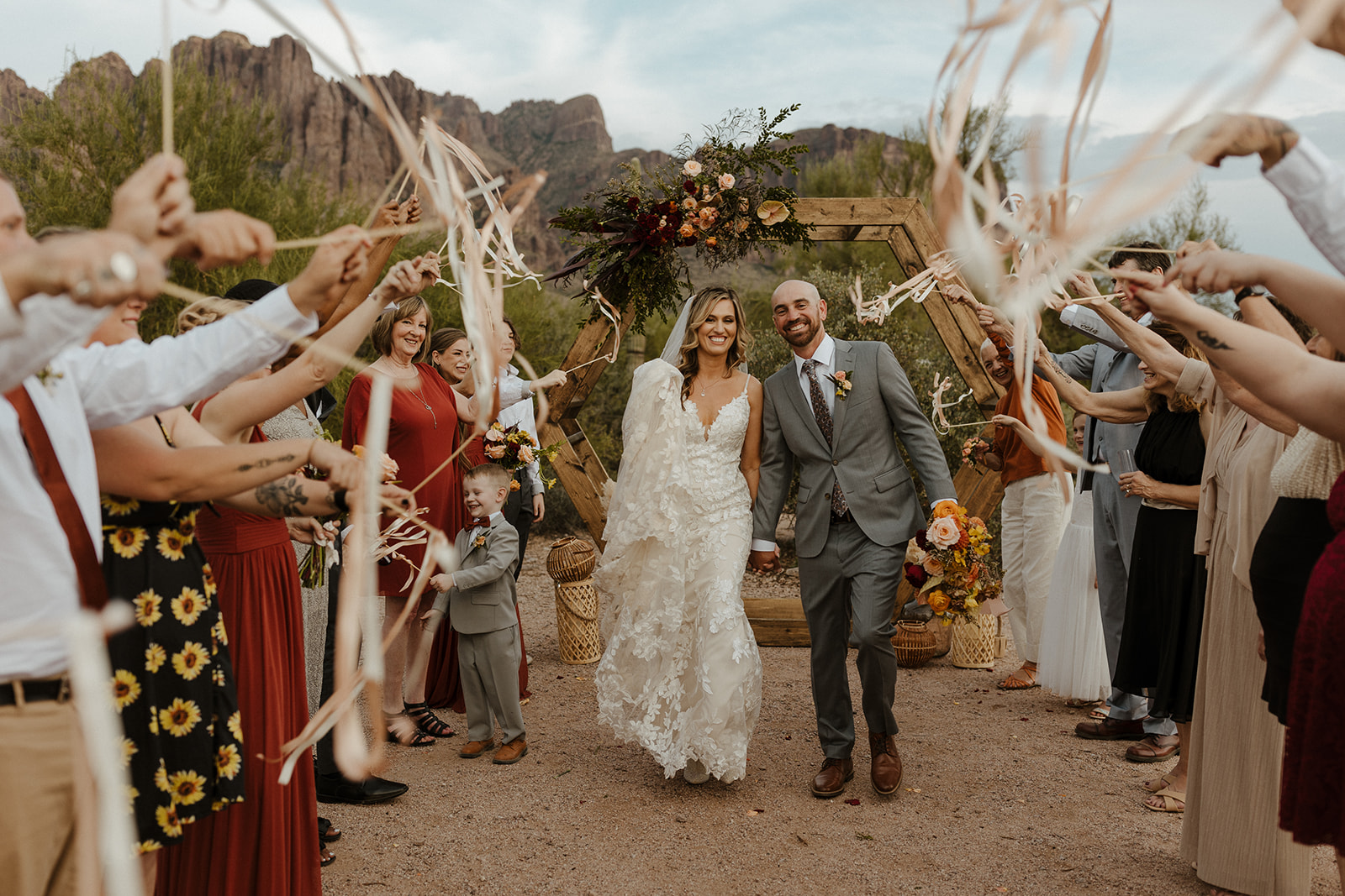 Bride and groom exit their stunning lost dutchman state park wedding ceremony