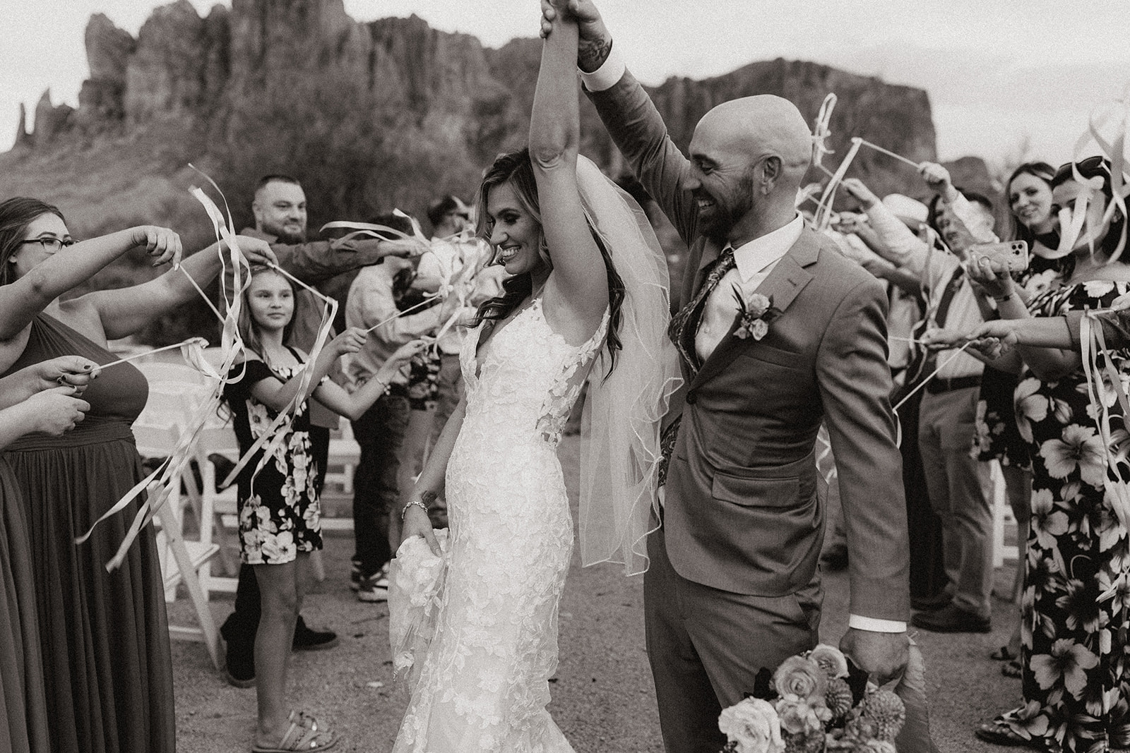 bride and groom dance together as their guests celebrate their stunning Arizona wedding day