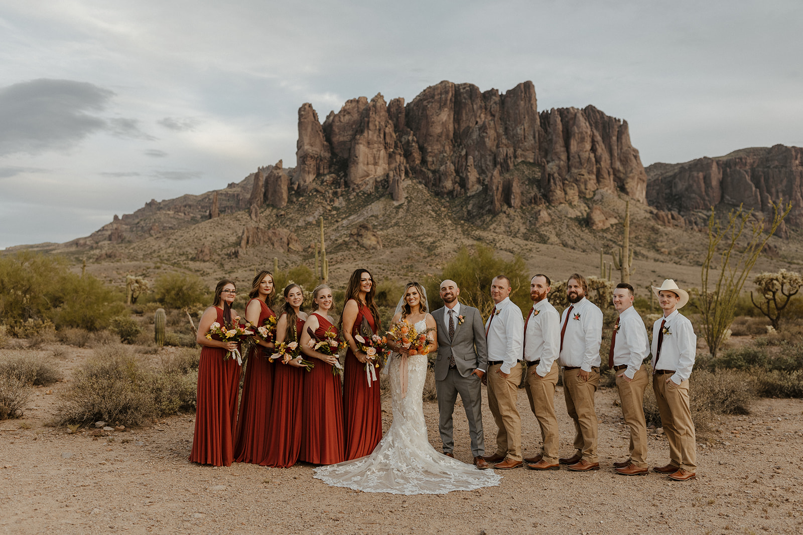 wedding party poses together with stunning Arizona nature in the background