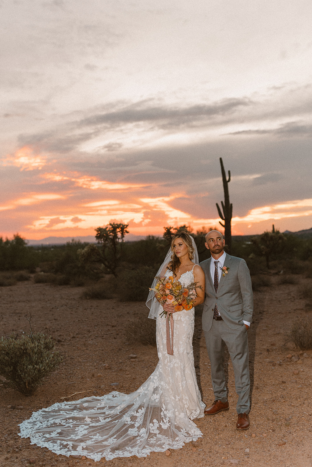 beautiful bride and groom pose during golden hour after their lost dutchman state park wedding