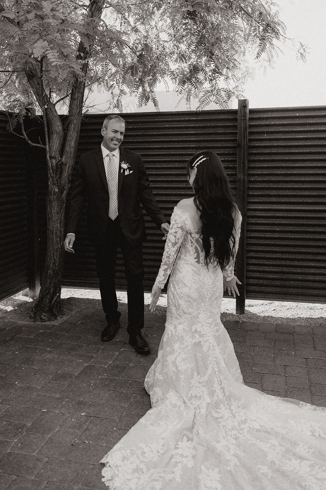 bride greets her dad in a heartwarming first look wedding photoshoot