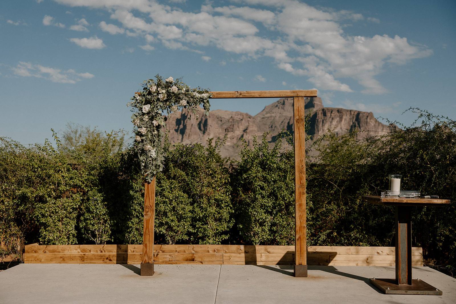 Beautiful Arizona mountain range sits over the desert wedding ceremony site