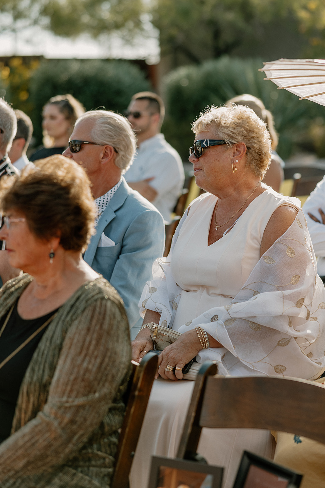 Guests sit and watch as the Arizona desert wedding takes place