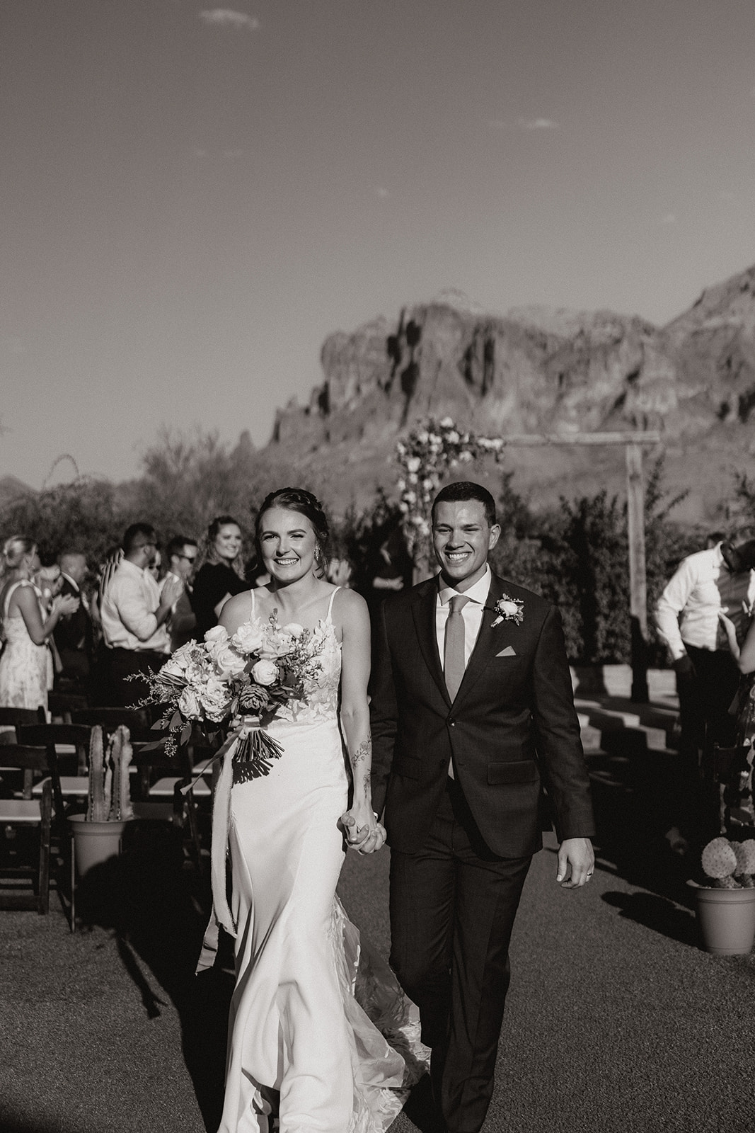 Stunning bride and groom exit their dreamy Arizona wedding ceremony
