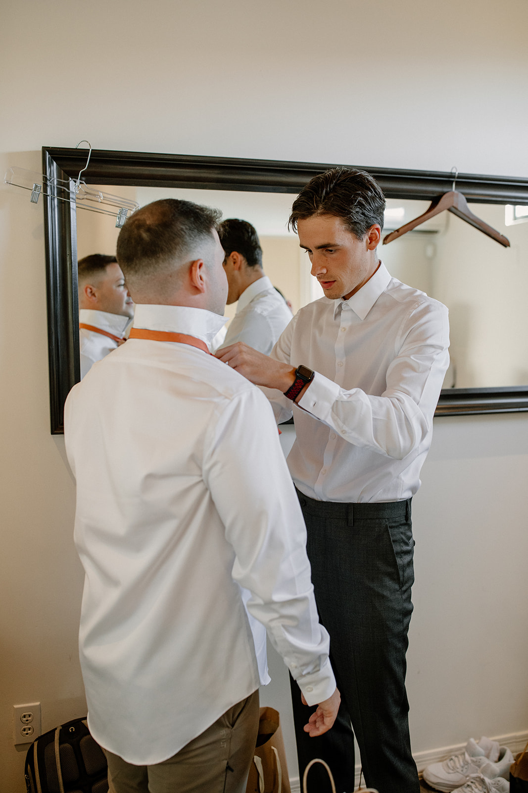 Groom gets help tying his tie before his dreamy AZ wedding day