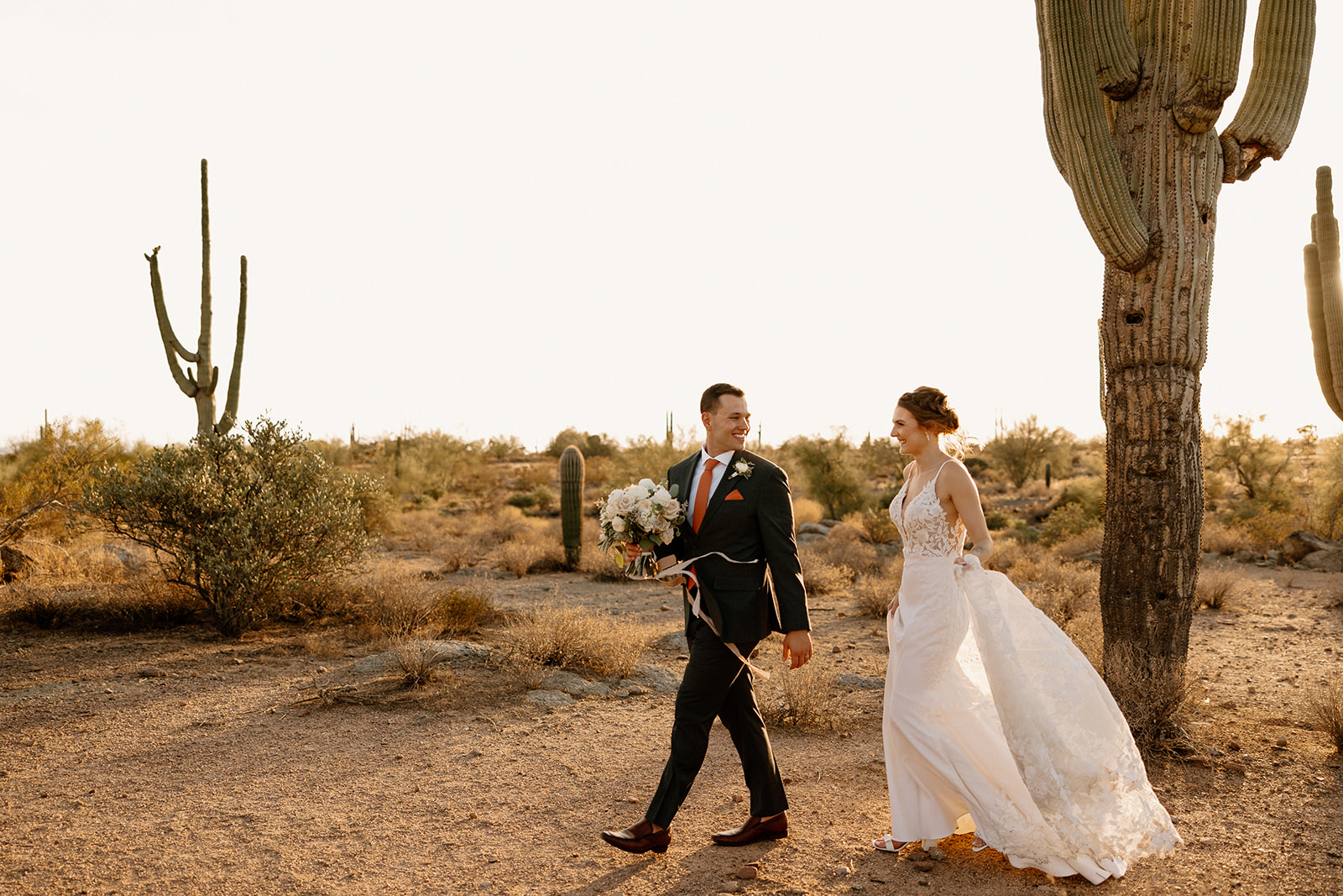 Bride and Groom pose in the desert after their stunning Arizona desert wedding