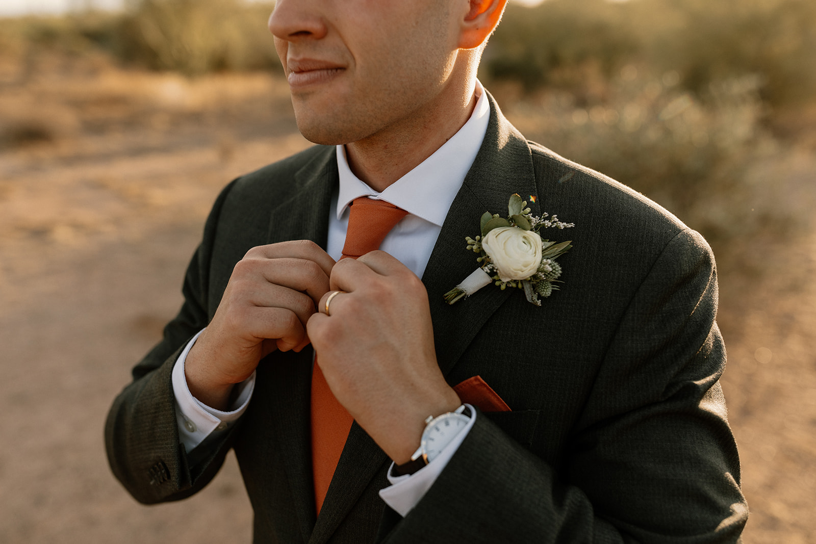 Groom poses in the desert after his stunning Arizona wedding