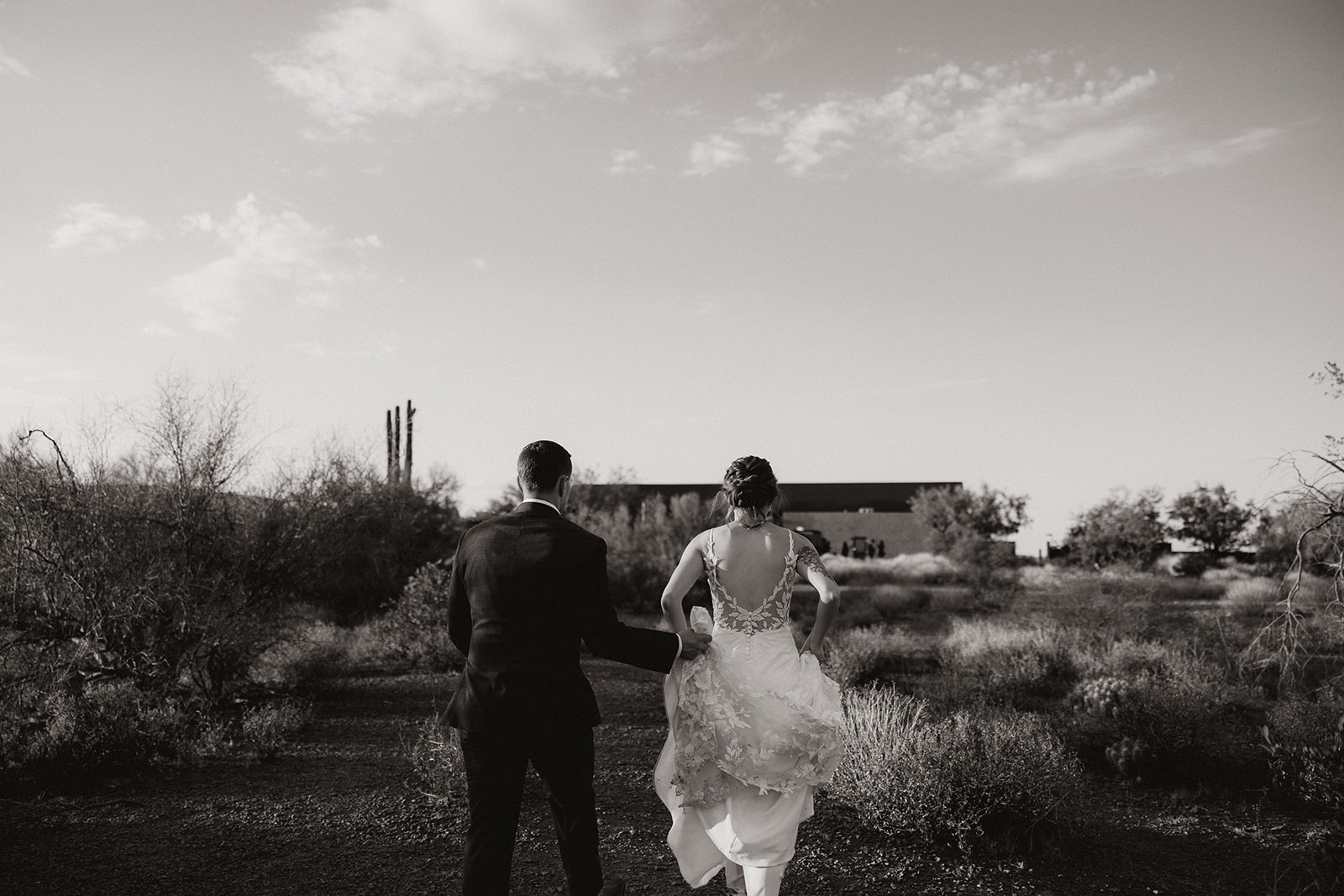 Bride and Groom pose in the desert after their stunning Arizona desert wedding