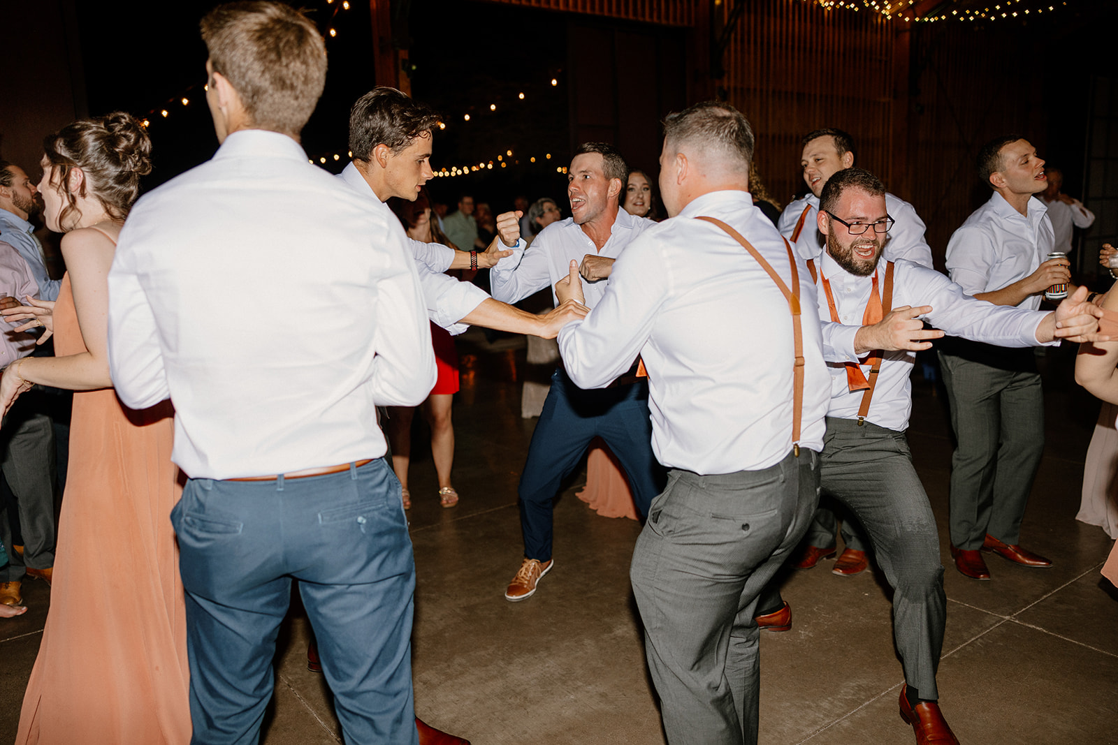 Groomsmen dance and enjoy the reception 