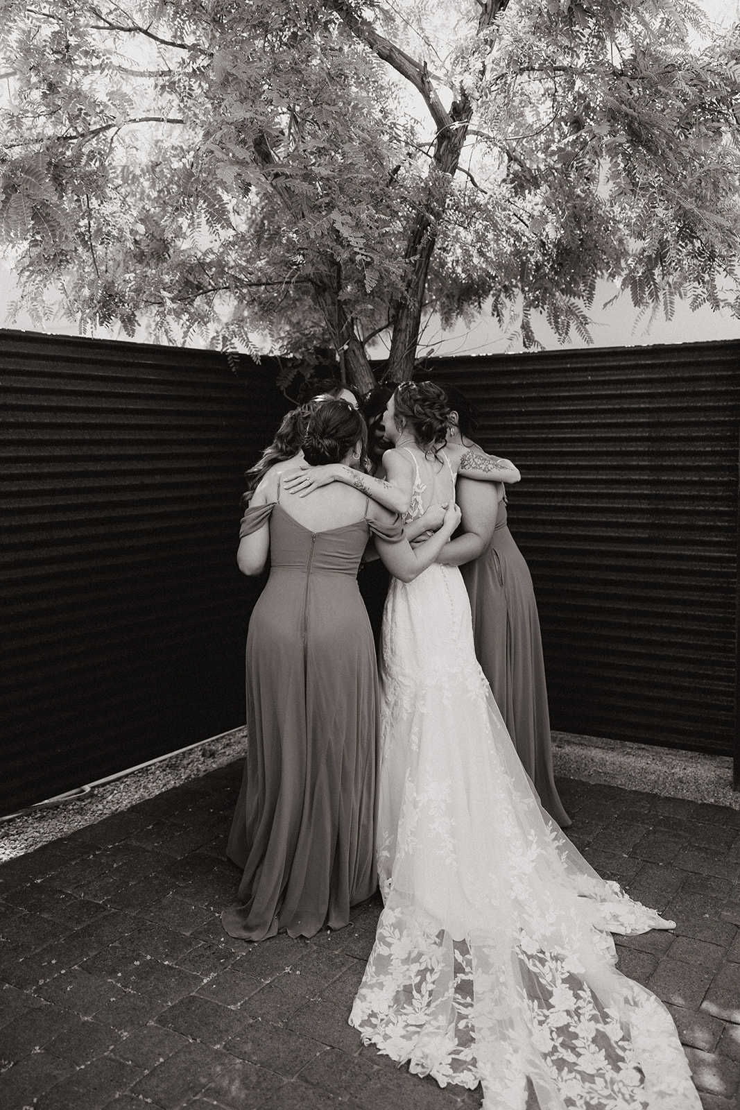 First look photos between a beautiful bride and her bridesmaids 