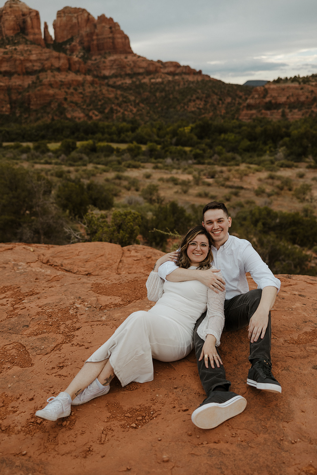 Beautiful couple pose together with the beautiful Arizona nature in the background 