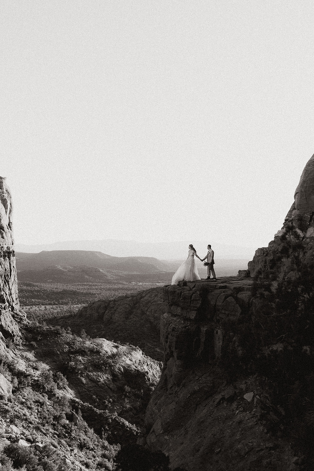 beautiful bride and groom pose together during their desert elopement ceremony their stunning Arizona desert elopement