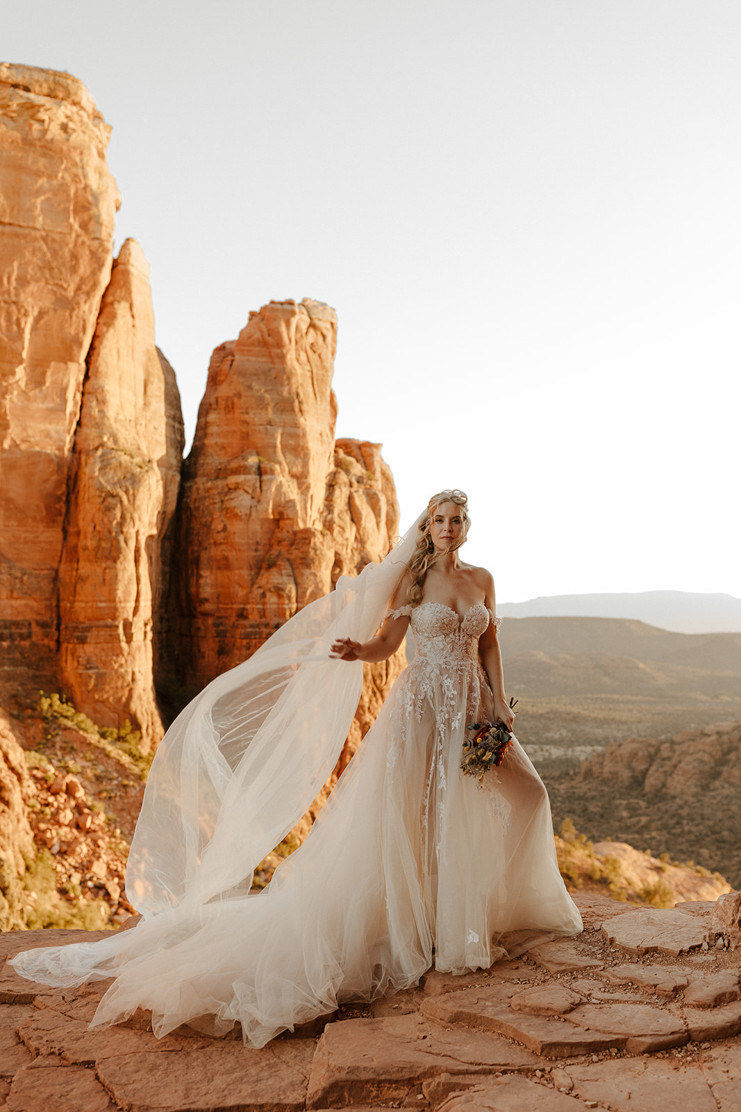 beautiful bride pose during their desert elopement ceremony their stunning Arizona desert elopement