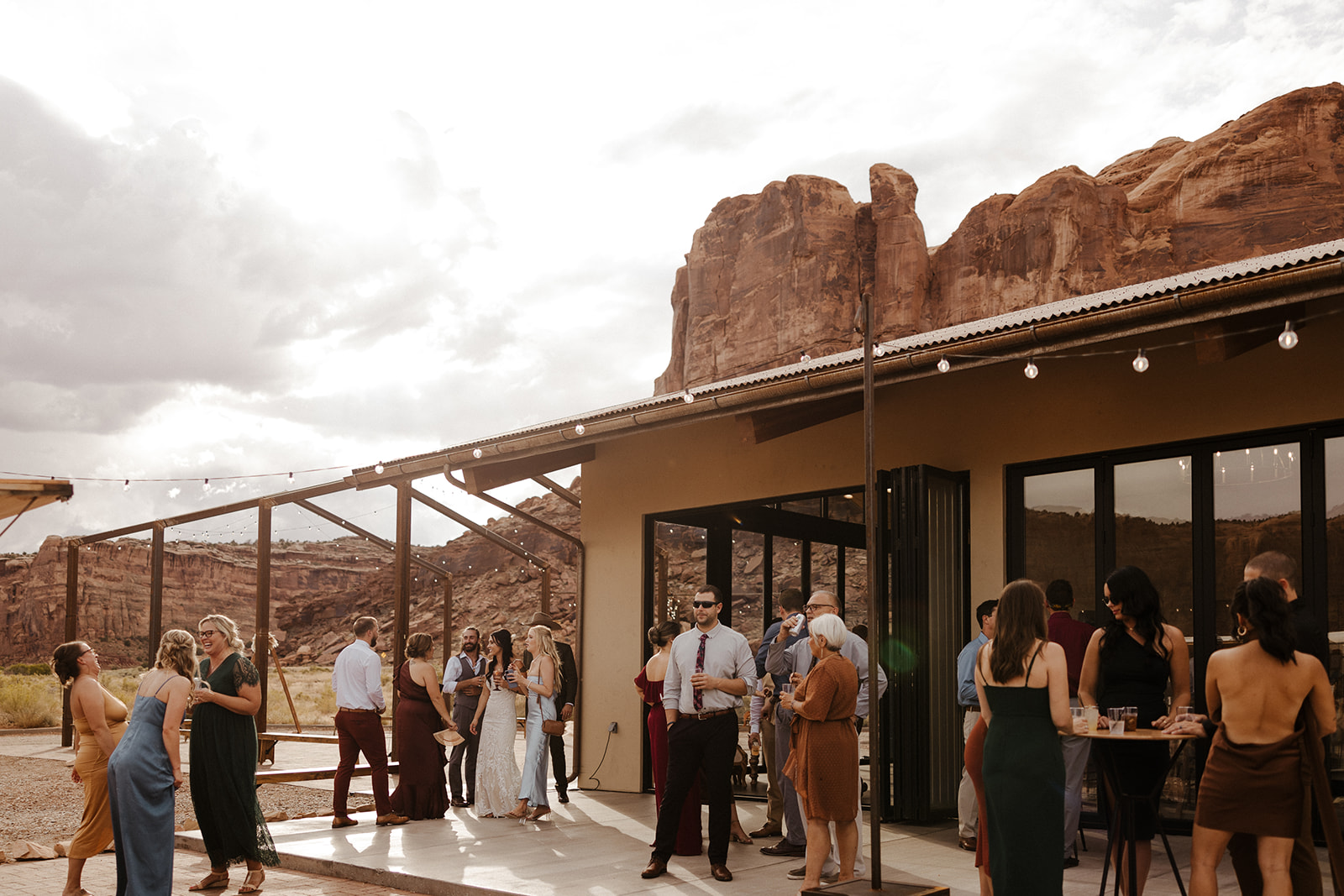guests mingle during cocktail hour with the dreamy Arizona nature in the background