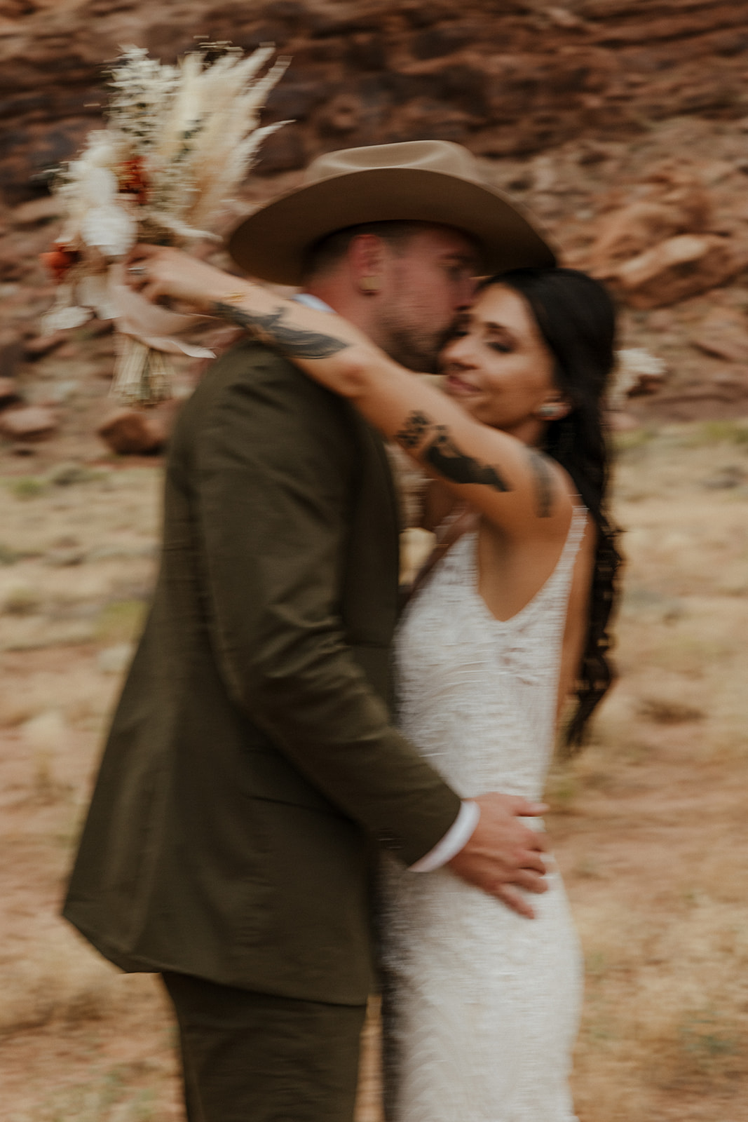 stunning bride and groom pose together after their stunning Arizona wedding day