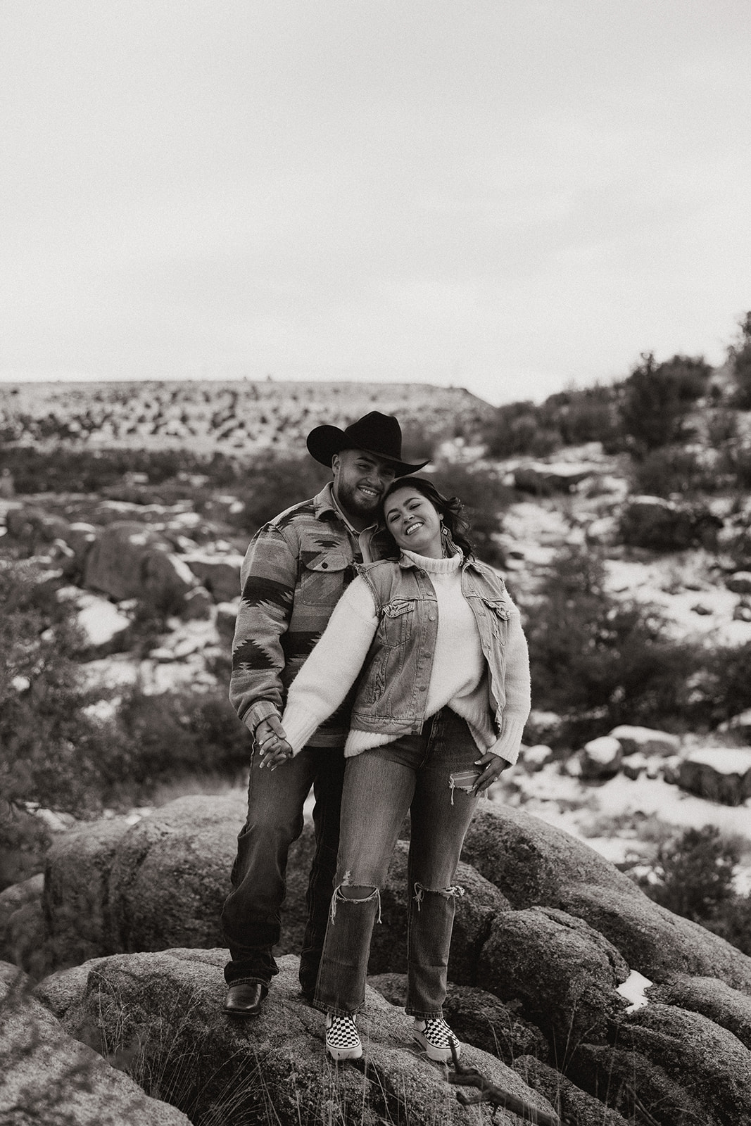beautiful couple pose with stunning Arizona landscape in the background