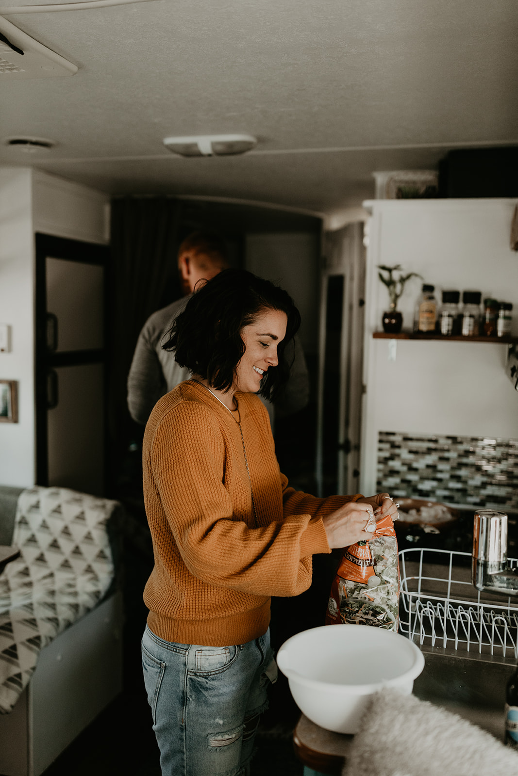 wife preps food in the kitchen