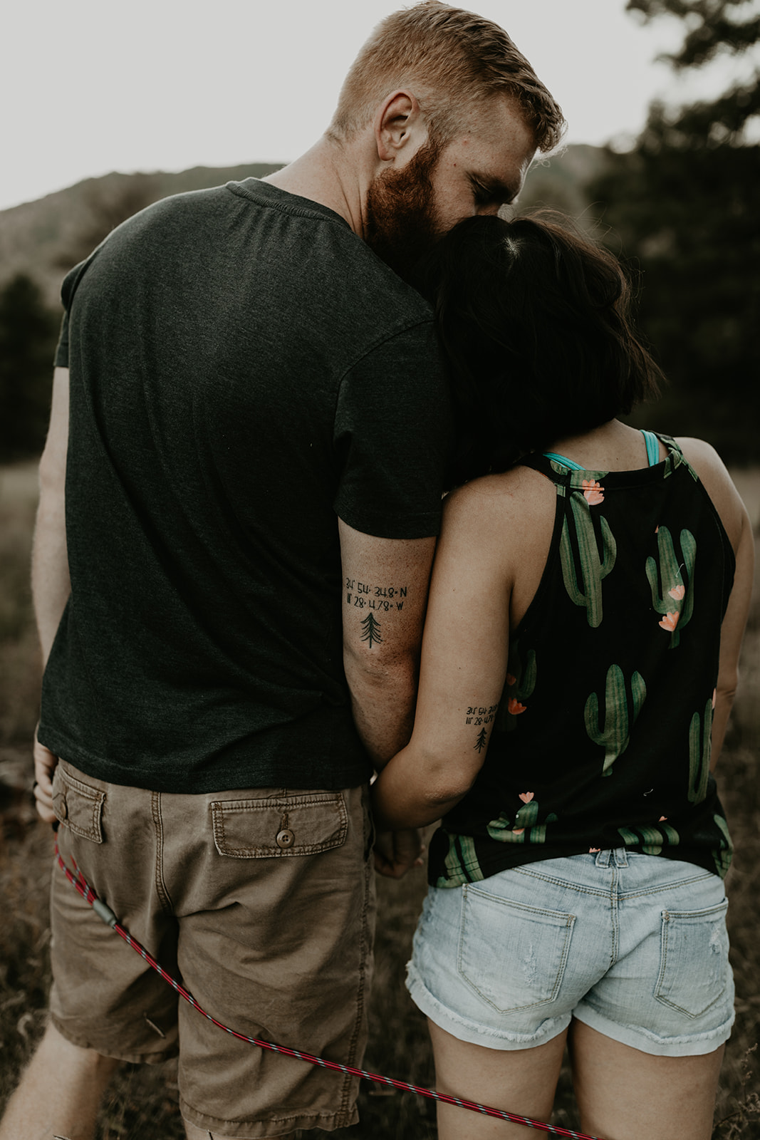 husband and wife pose together in the beautiful Arizona nature