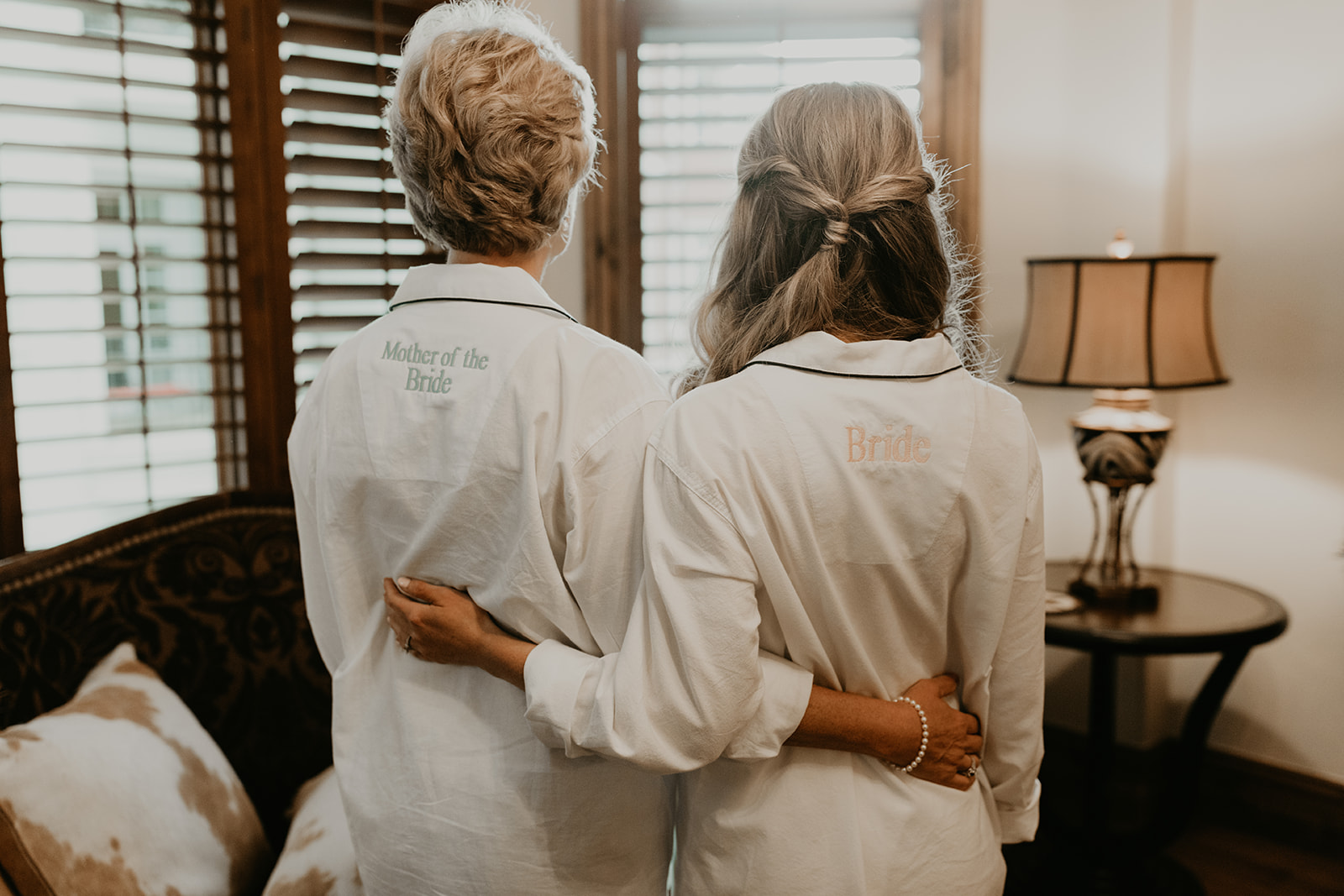 bride and her mom showcase their custom robes before her dreamy  Betty Ford Alpine Gardens Wedding