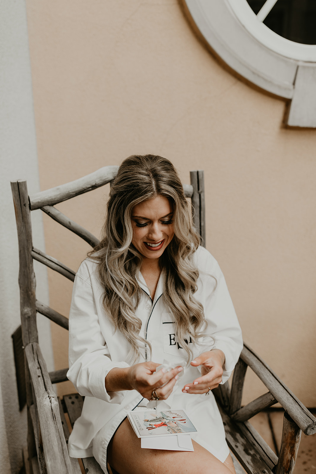 bride chuckles as she reads her soon to be husbands private vows 