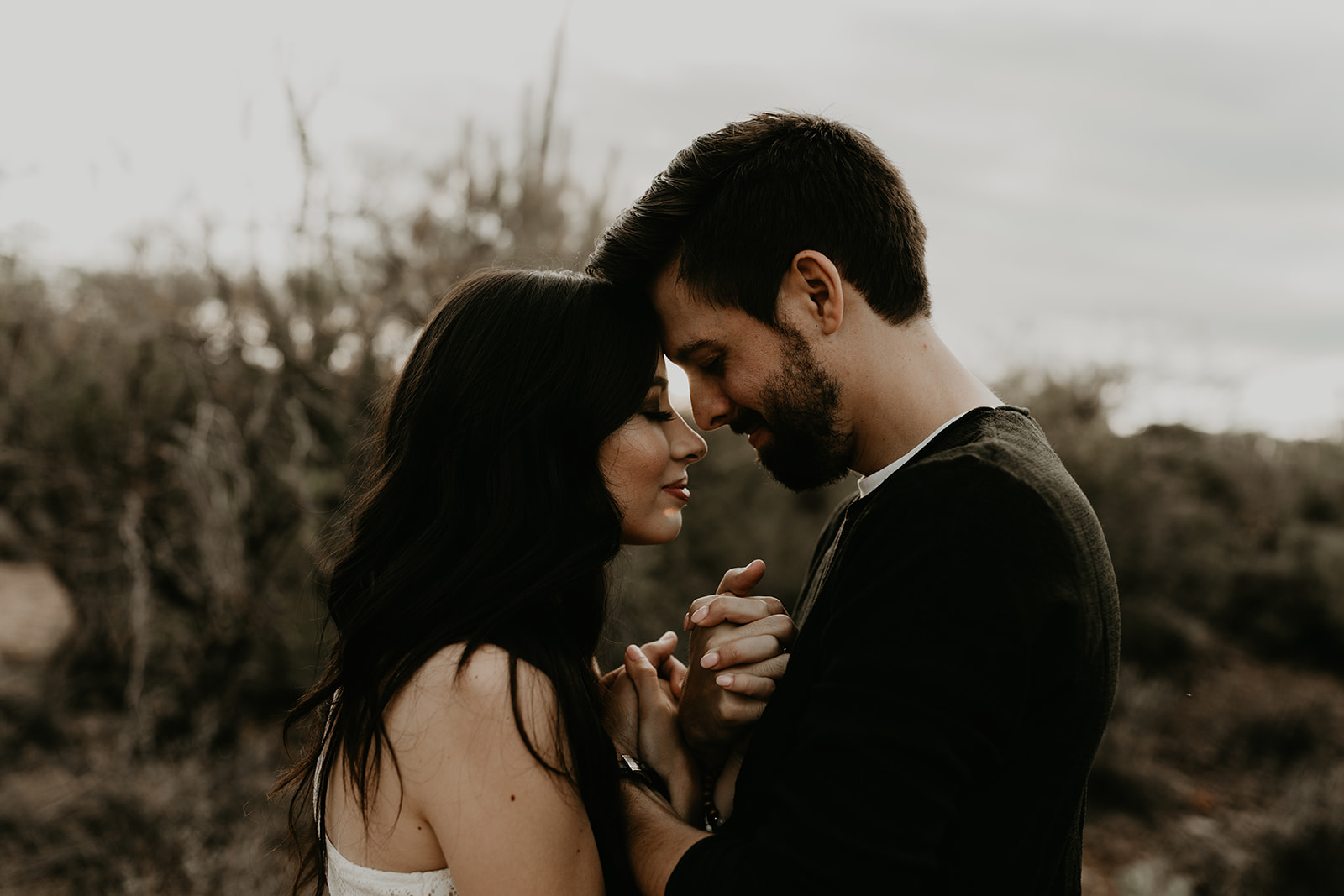 stunning couple pose romantically during their hiking engagement photos