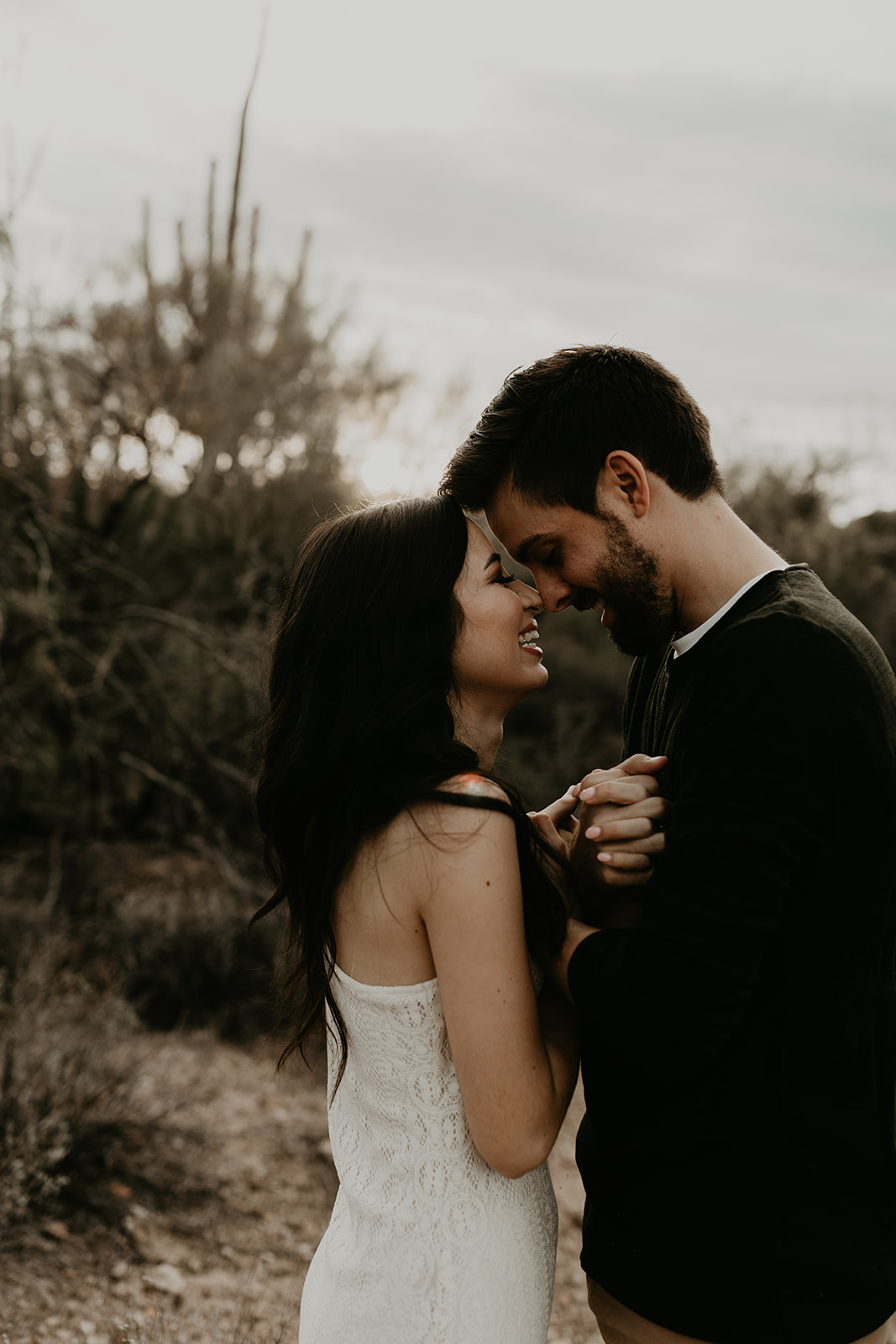 beautiful couple share an intimate moment during their hiking engagement photos