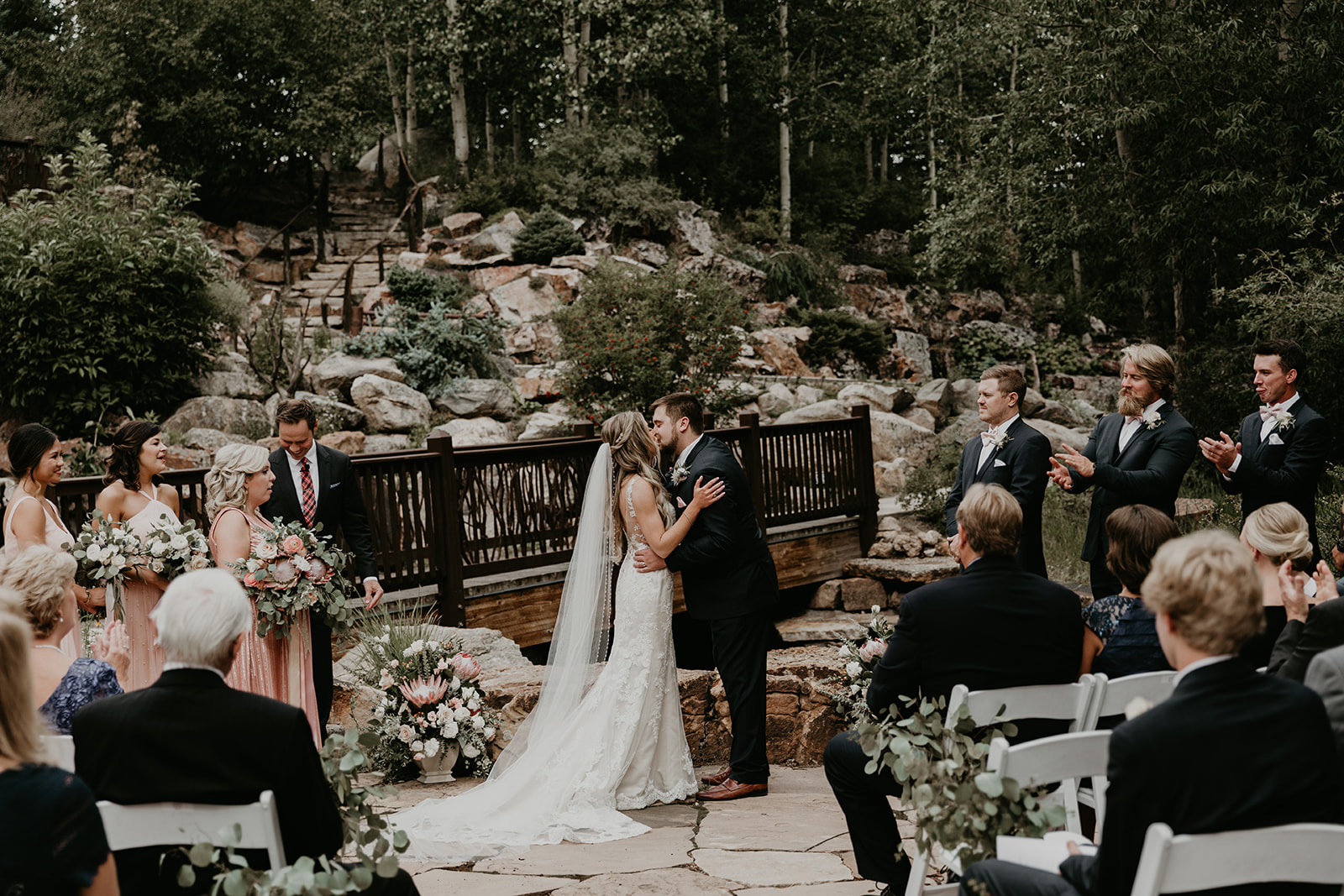 bride and groom share their first kiss as husband and wife