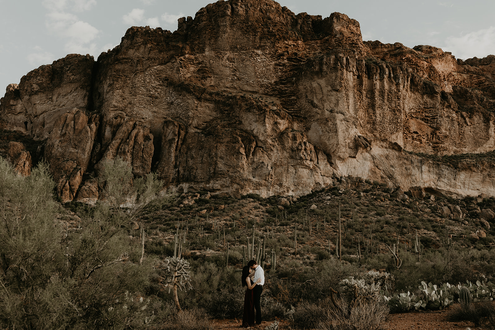 stunning couple pose in the Arizona nature during their hiking engagement photos