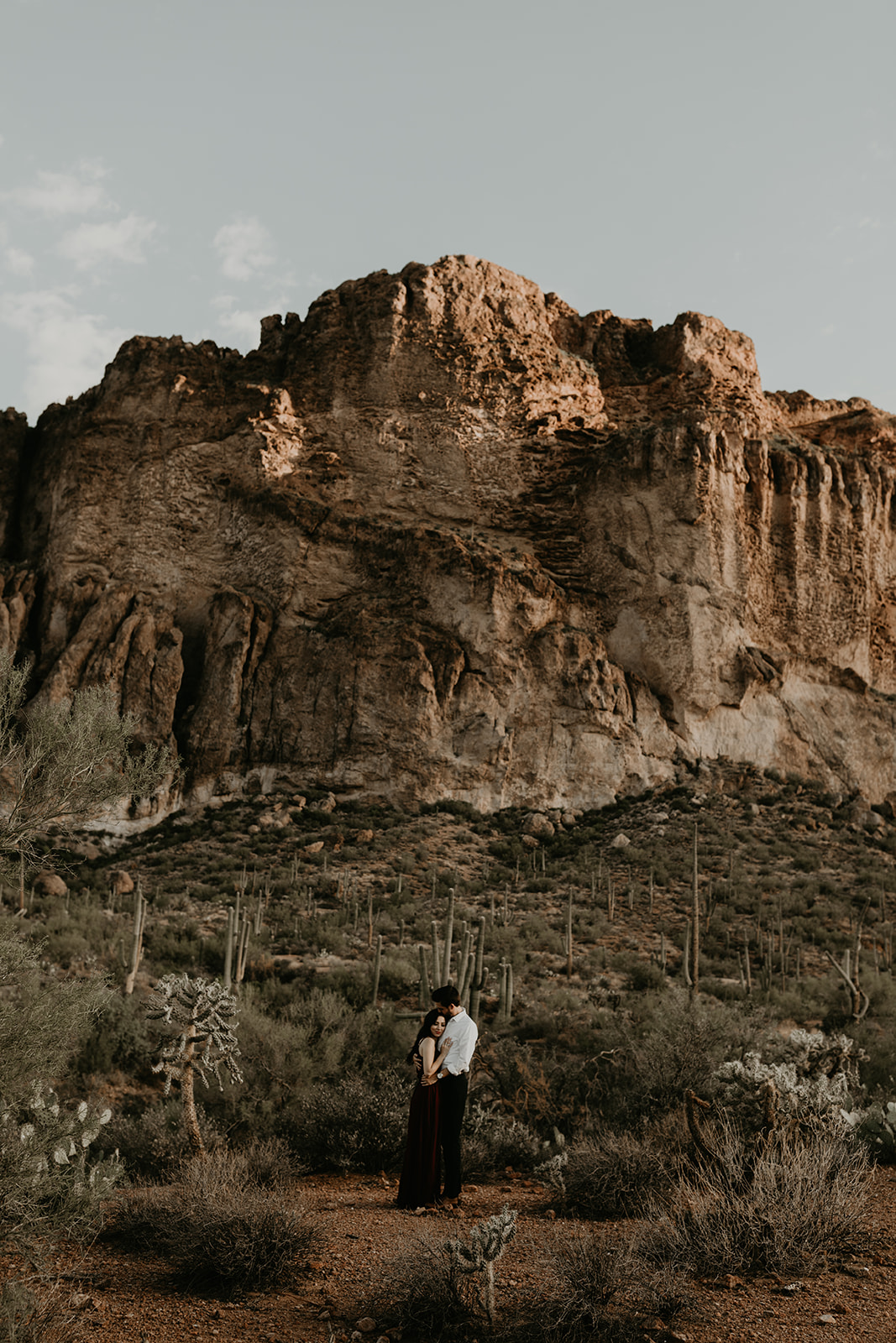 stunning couple pose with the Arizona nature in the background during their hiking engagement photos