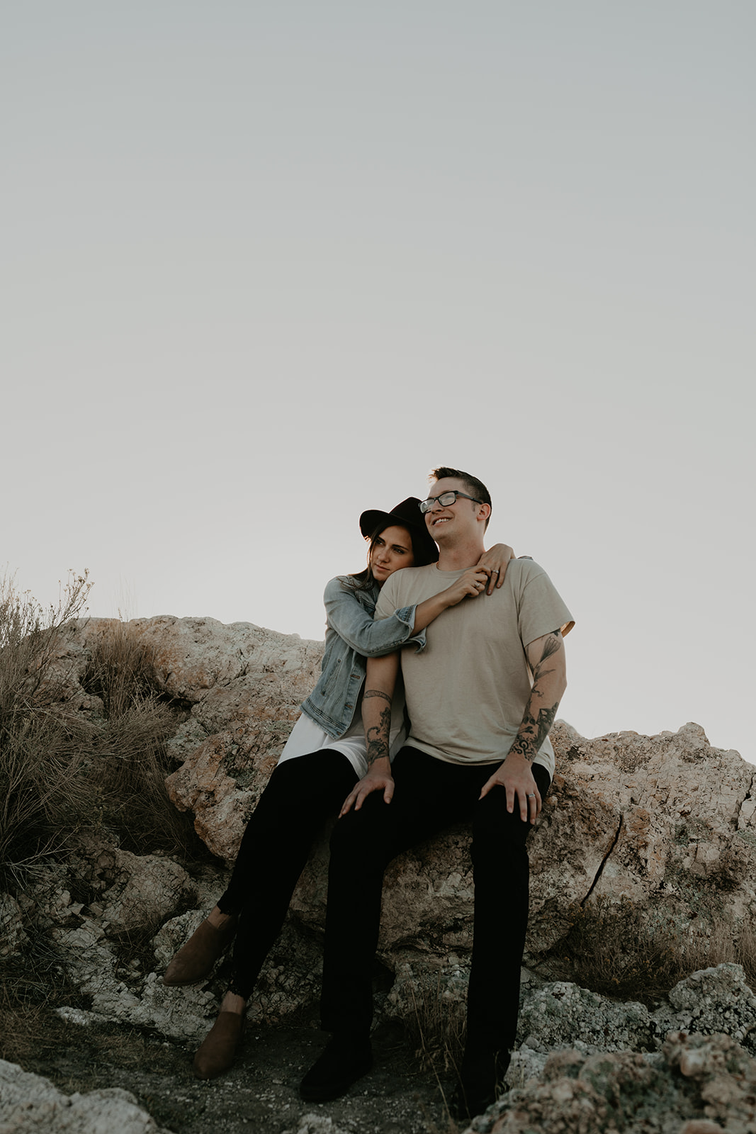 couple pose together on rocks in the beautiful Utah nature during their Engagement photos in Utah