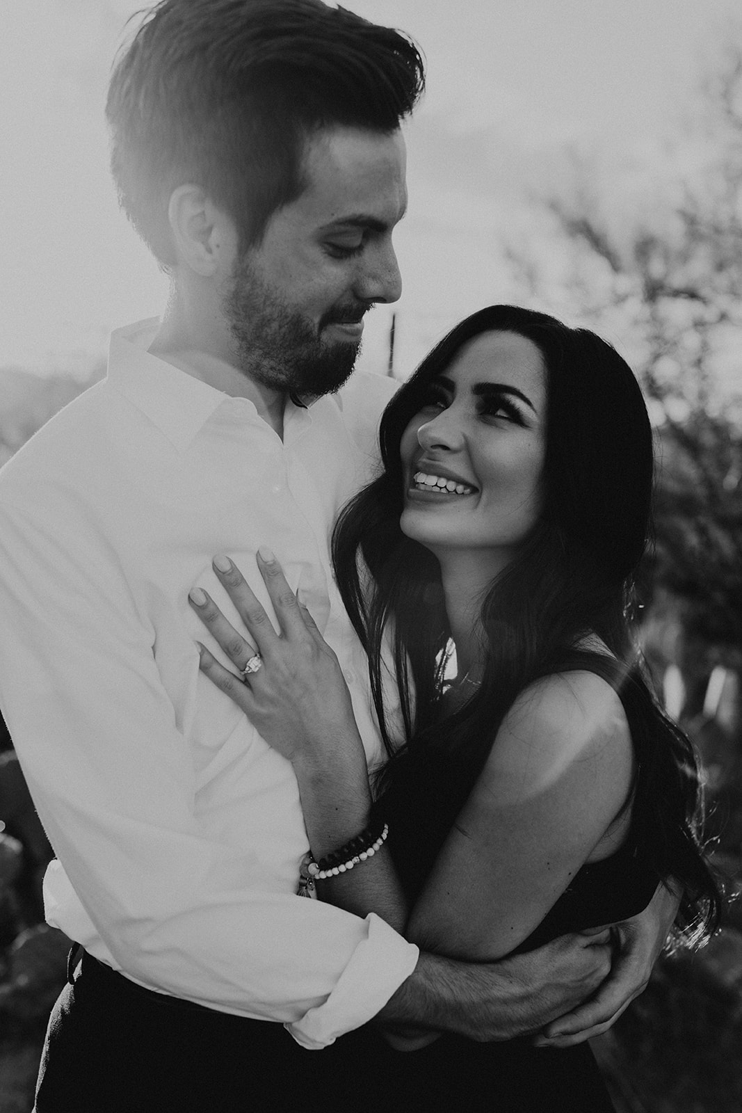 beautiful couple pose together during their Arizona engagement photoshoot 