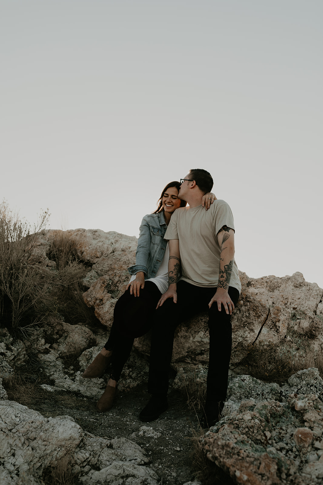 couple pose together on rocks in the beautiful Utah nature during their Engagement photos in Utah