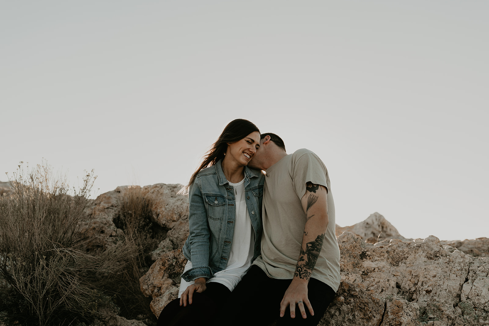 couple pose together on rocks in the beautiful Utah nature during their Engagement photos in Utah