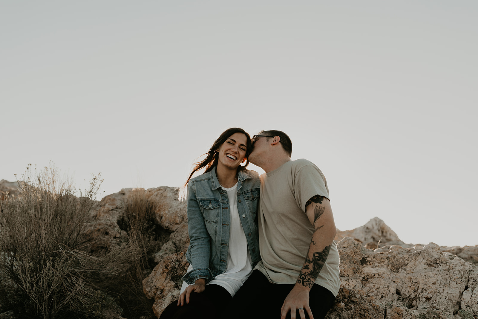 couple pose together on rocks in the beautiful Utah nature during their Engagement photos in Utah