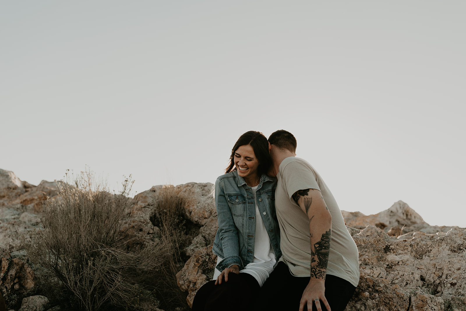 couple pose together on rocks