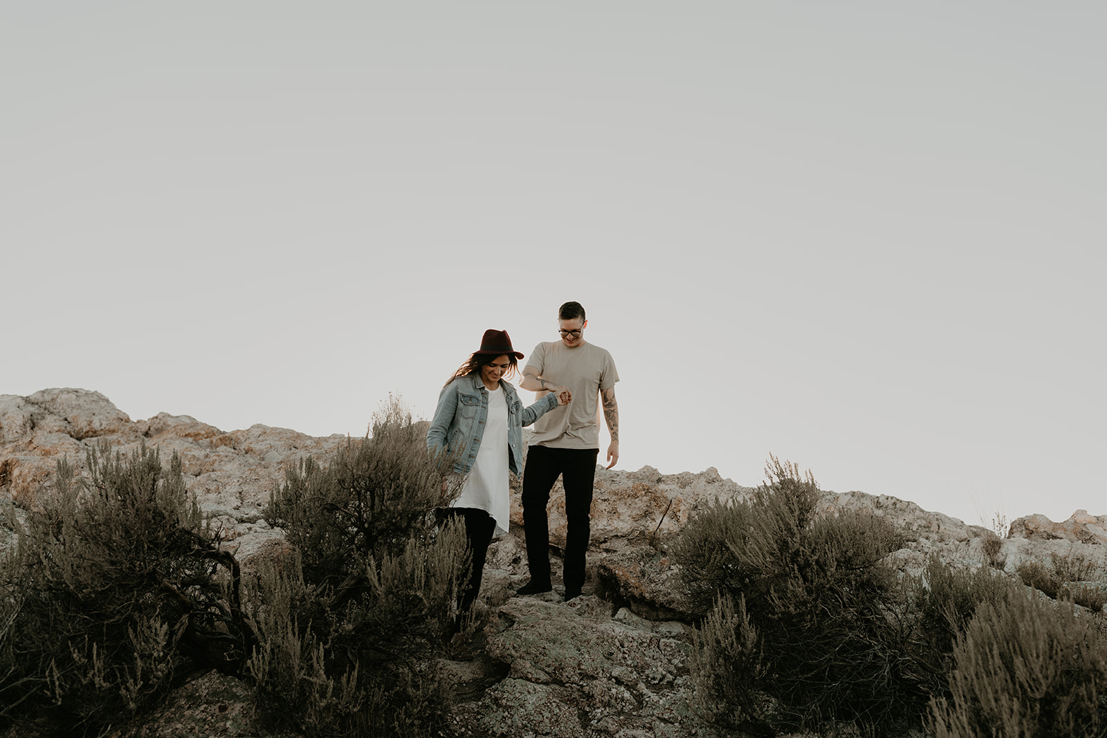 couple pose together on rocks in the beautiful Utah nature during their Engagement photos in Utah