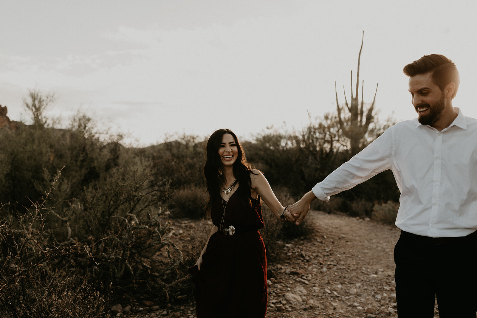 stunning couple pose in the Arizona nature during their hiking engagement photos