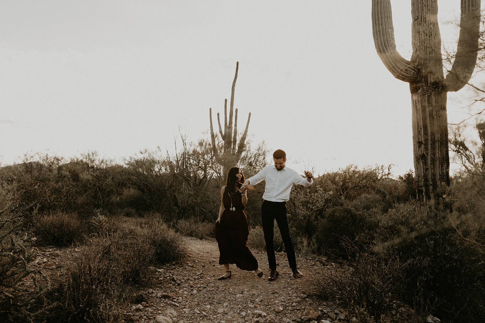 stunning couple pose in the Arizona nature during their hiking engagement photos