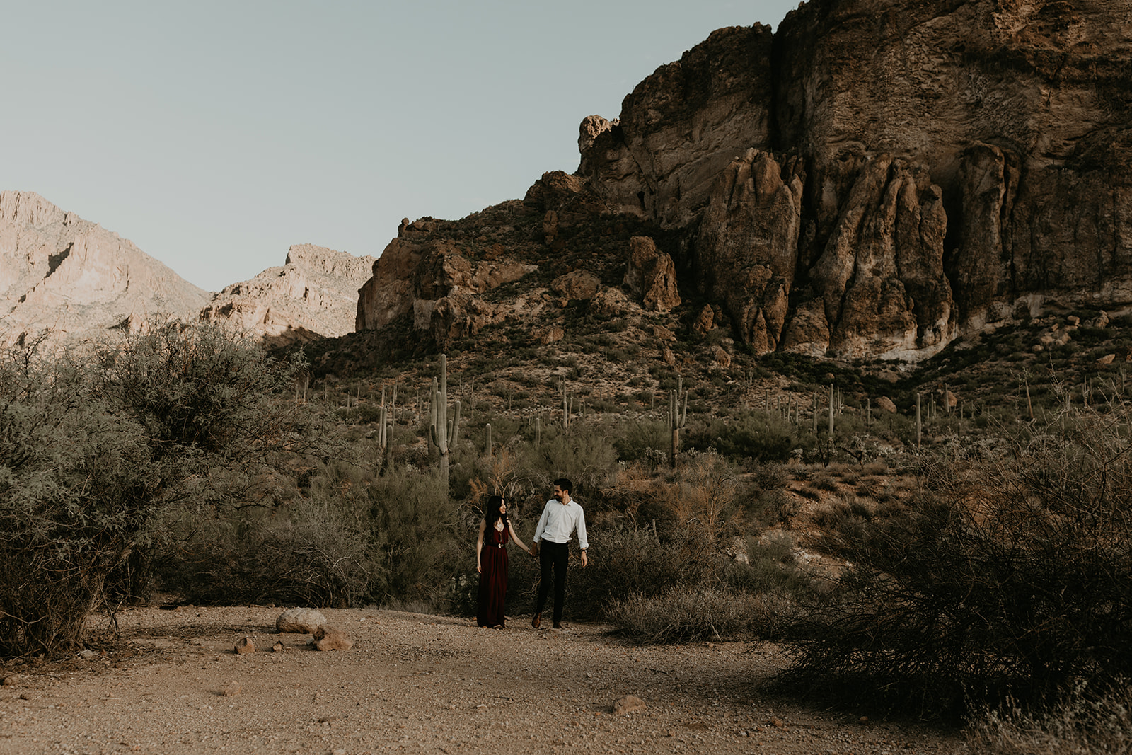 stunning couple pose in the Arizona nature during their hiking engagement photos